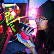 Computer screen, phone call or girl hacker in basement in dark room at ...