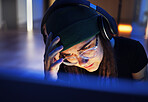 Hacker, problem and woman with a computer for cyber security, stress headache and reading information at night. Tired, error and hacker with headphones, stealing network and scam on a system in dark