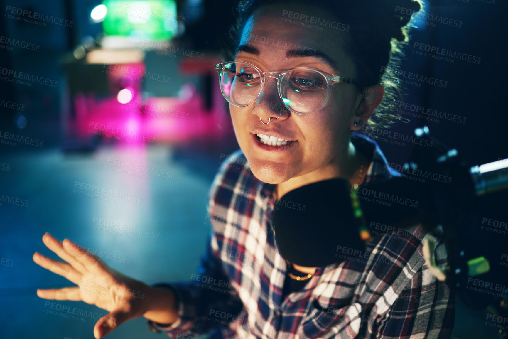 Buy stock photo Podcast, microphone and young woman speaking, advice or broadcast on gen z platform, live streaming and night neon. Influencer person voice talking on mic for news, politics or media report or radio