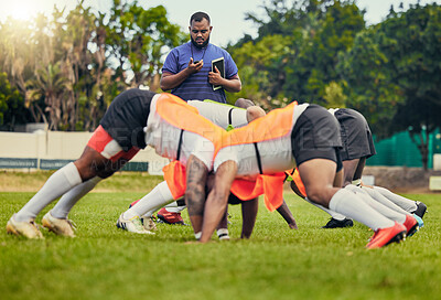 Buy stock photo Rugby, sports and men in scrum for training on grass field ready for match, practice and sport game. Fitness, performance and team with coach tackle for warm up, exercise and workout for tournament