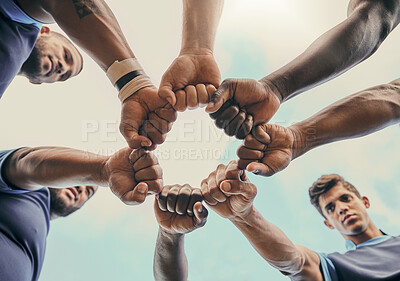 Buy stock photo Hands, fist and solidarity with a sports team standing in a huddle for unity or motivation before a game. Fitness, teamwork and diversity with a group of men in a circle, getting ready for a match