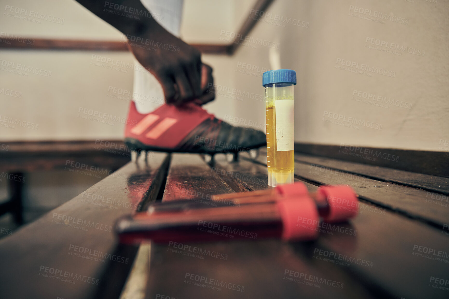 Buy stock photo Rugby, blood and urine sample in a locker room for sports regulations or anti doping testing. Fitness, health and medical with an athlete getting ready after a drug test for an illegal substance