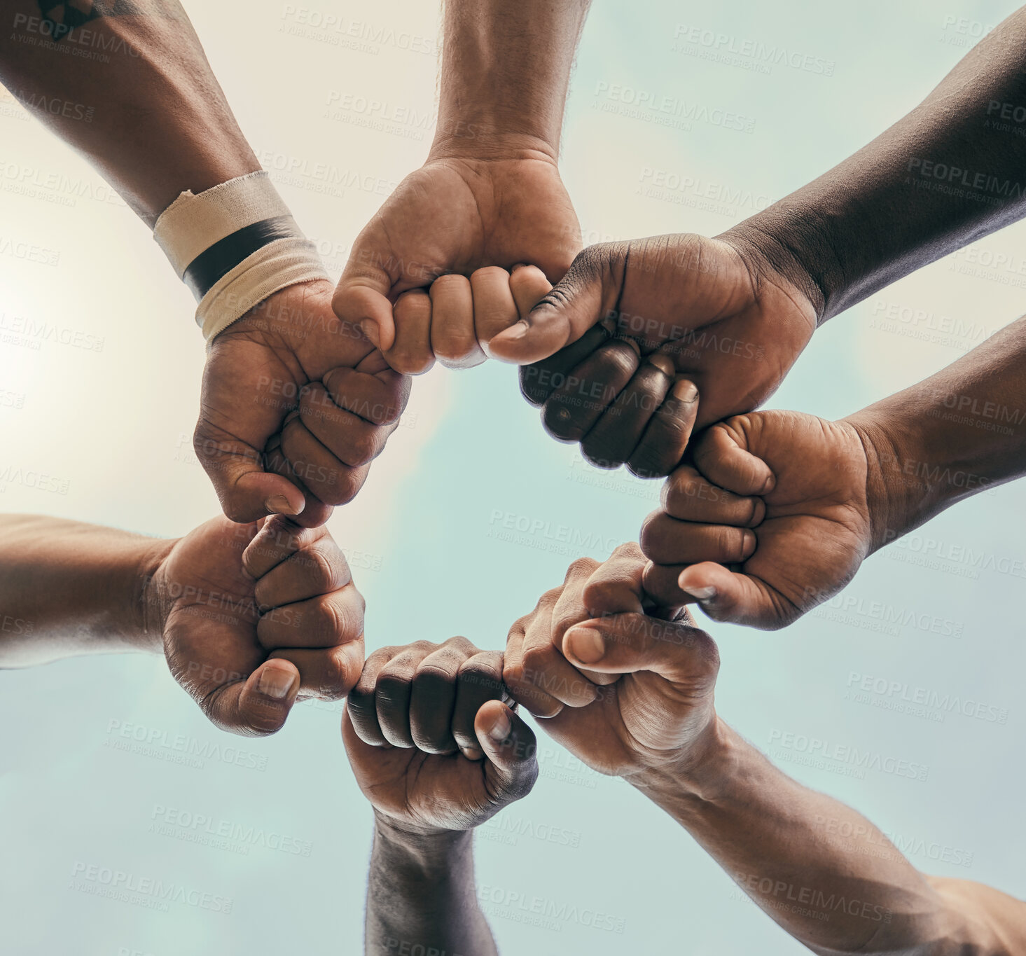 Buy stock photo Hands, fist and unity with a sports team standing in a huddle for solidarity or motivation before a game. Fitness, teamwork and diversity with a group of men in a circle, getting ready for a match