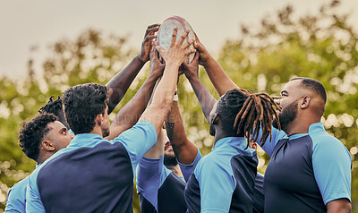 Buy stock photo Diversity, team and men hands together in sports for support, motivation or goals outdoors. Sport group holding rugby ball in fitness, teamwork or success for match preparation or game