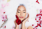 Relax, roses and above of a woman in a bubble bath for luxury, wellness and peace. Content, clean and the face of a beautiful sleeping girl in floral water for relaxing, grooming and stress relief