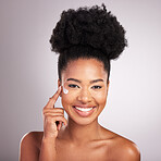 Black woman, face and moisturizer cream for skincare beauty or cosmetics against a gray studio background. Portrait of happy African female with smile for moisturizing creme, lotion or facial product