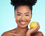 Lemon, skincare beauty and woman portrait of facial, wellness and detox healthcare. Isolated, blue background and studio with a young female feeling happy from healthy food with vitamin c for glow