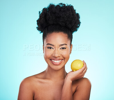 Buy stock photo Lemon beauty, portrait and happy black woman in studio, blue background and vegan wellness. Happy model, citrus fruits and smile for facial cosmetics, vitamin c skincare and natural detox dermatology