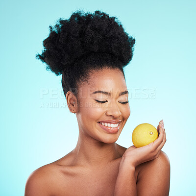 Buy stock photo Lemon, skincare happiness and woman with beauty, wellness and detox healthcare. Isolated, blue background and studio with a young female feeling happy from healthy food with vitamin c for glow