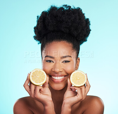 Buy stock photo Lemon, portrait and beauty of happy black woman in studio, blue background or vegan wellness. Happy model, citrus fruits and smile of facial cosmetics, vitamin c skincare or natural detox dermatology