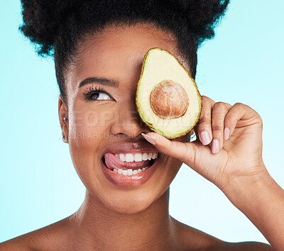 Buy stock photo Avocado, woman tongue out and happy face of a young model with skincare, fruit and wellness for diet. Isolated, blue background and studio with a silly person with beauty, cosmetics and healthy food 