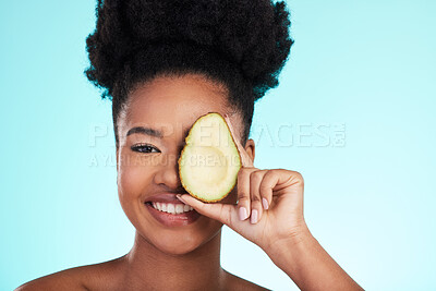 Buy stock photo Avocado, woman smile and portrait of a young model with skincare, fruit and wellness for diet. Isolated, blue background and studio with a person with beauty, cosmetics and healthy food for skin glow