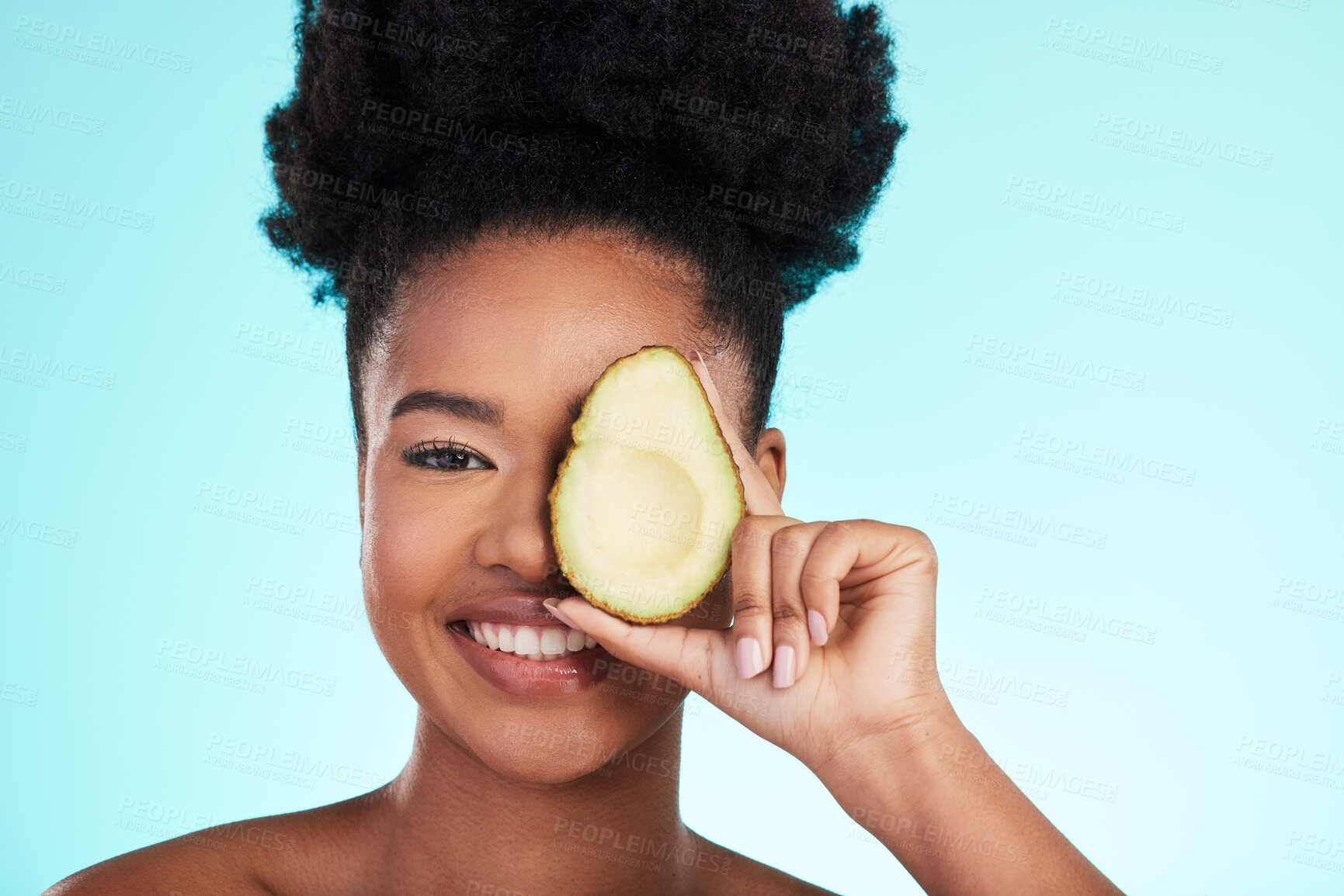 Buy stock photo Avocado, woman smile and portrait of a young model with skincare, fruit and wellness for diet. Isolated, blue background and studio with a person with beauty, cosmetics and healthy food for skin glow