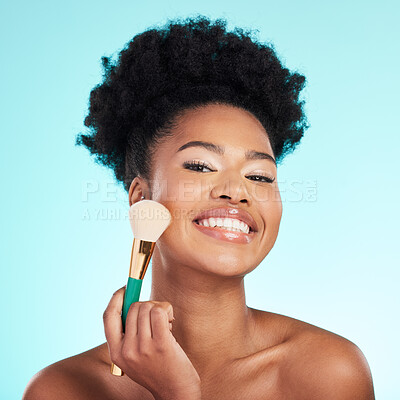 Buy stock photo Black woman, brush and foundation in studio with smile for wellness, cosmetics or youth by blue background. Model, girl and african with makeup, powder and happy for skincare, beauty and healthy glow