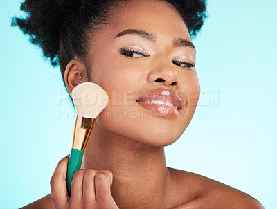 Buy stock photo Makeup, brush and face of black woman for beauty, cosmetics and facial treatment on blue background. Salon, cosmetology and happy girl with brushes for foundation, skincare and application in studio
