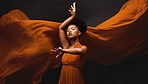 Black woman, art and fashion, fabric on dark background with dance and aesthetic movement. Flowing silk, fantasy and artistic portrait of serious African model in creative designer dress in studio.