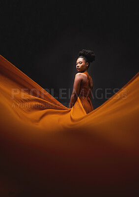 Buy stock photo Black woman, art and fashion, fabric on dark background with mockup and aesthetic movement. Flowing silk, fantasy and artistic portrait of serious African model in creative designer dress in studio.