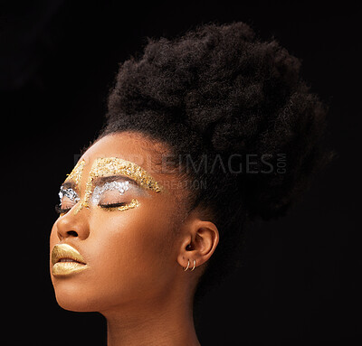 Beauty, gold and glow with black woman and makeup in studio for luxury, cosmetics or African pride. Natural, creative and goddess with female model on background for queen, bronze and glamour