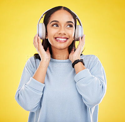 Buy stock photo Happy, music and headphones with woman in studio for streaming, online radio and audio. Smile, media and podcast with female isolated on yellow background for technology, listening and connection