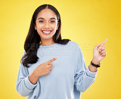 Buy stock photo Yellow background, point and portrait of woman with smile for advertising, promotion and announcement. Mockup space, studio and isolated happy girl with hand gesture for information, discount or news