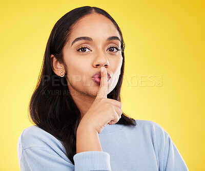 Buy stock photo Secret, portrait and woman with finger on lips in studio, yellow background and privacy sign. Face of female model, silence and shush for quiet, gossip and whisper emoji for confidential mystery news