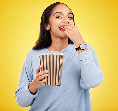 Buy stock photo Happy woman is eating popcorn, watching tv and portrait, box with snack for movie on yellow studio background. Streaming service, film and food with corn treat, female with smile and cinema