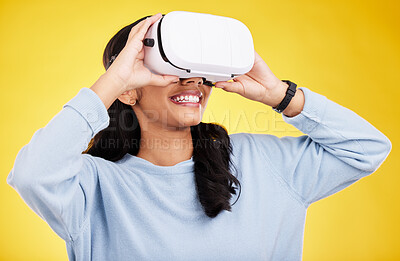 Buy stock photo Woman with VR goggles, smile and experience in metaverse, digital world and futuristic on yellow studio background. Virtual reality, technology and UX, happiness and cyber space with gaming