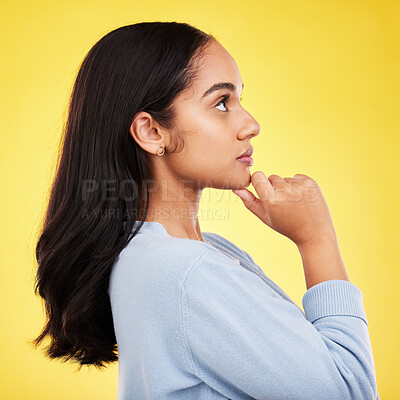 Buy stock photo Woman, profile and studio with a young model thinking with casual fashion feeling relax. Isolated, yellow background and gen z female person with youth and healthy hair care posing and relaxing 