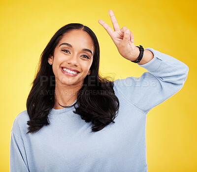 Buy stock photo Happy, woman and portrait of peace fingers in studio, background and color backdrop. Female model, v sign and smile with hands for victory, fun mood and happiness of gen z, victory and freedom emoji 