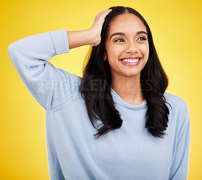 Buy stock photo Thinking, smile and a woman on a yellow background in studio contemplating a happy memory. Idea, vision and mindset with an attractive young female looking thoughtful about the distant future