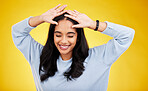 Happy, dance and face of woman on yellow background for positive mindset, happiness and freedom. Smile, mockup space and isolated girl with hands on head for dancing, relaxing and calm in studio