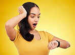 Late, watch and surprise of a woman in a studio looking at time with alarm feeling shocked. Isolated, yellow background and young female model with shock from watching the clock and smartwatch