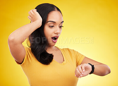 Buy stock photo Late, watch and surprise of a woman in a studio looking at time with alarm feeling shocked. Isolated, yellow background and young female model with shock from watching the clock and smartwatch