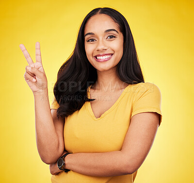 Buy stock photo Portrait of woman, smile and peace fingers in studio, yellow background and color backdrop. Happy female model, v sign and hands of victory, fun mood and happiness of gen z, victory and freedom emoji