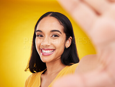 Buy stock photo Happy, smile and selfie with woman in studio for social media, confidence and picture. Photo, happiness and relax with portrait of female on yellow background for beauty, self care and influencer