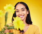 Flowers, happy and portrait of woman on yellow background with smile, happiness and cosmetics. Spring mockup, beauty and face of girl with floral blossom for nature, aesthetic and natural makeup