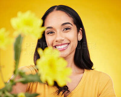 Buy stock photo Flowers, happy and portrait of woman on yellow background with smile, happiness and cosmetics. Spring mockup, beauty and face of girl with floral blossom for nature, aesthetic and natural makeup