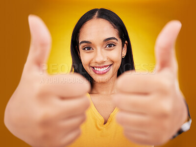 Buy stock photo Thumbs up, portrait and hands of happy woman in studio, excited winner and bonus on background. Female model, thumb and smile to celebrate winning achievement, like emoji and support, yes or feedback