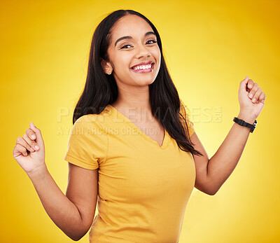 Buy stock photo Happy, young and portrait of a beautiful woman isolated on a yellow background in a studio. Casual, smile and a gorgeous girl looking cheerful, cute and fashionable in a bright shirt on a backdrop