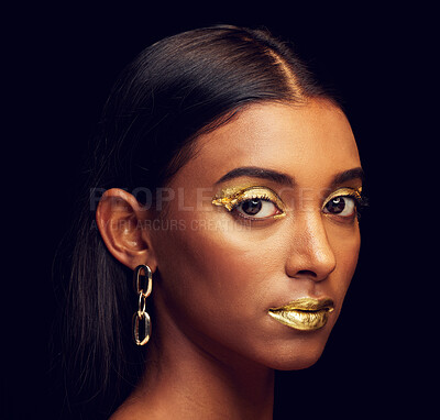 Buy stock photo Indian woman, festive makeup and studio portrait for beauty, wellness and celebration by black background. Model, asian girl or dark aesthetic with gold lipstick, jewellery and cosmetics for face art