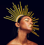 Crown, gold makeup and a beauty queen isolated on a black background in a studio. Dreaming. ethereal and an Indian girl with cosmetics, accessories and jewelry for royalty on a dark backdrop