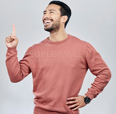 Buy stock photo Happy, smile and pointing with man in studio for idea, product placement and announcement. Success, confident and direction with male isolated on white background for positive, advertisement or pride