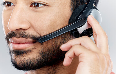 Buy stock photo Man, face and headset for call center, telemarketing or online customer service against gray studio background. Closeup of male consultant with headphones and mic for wireless communication or advice