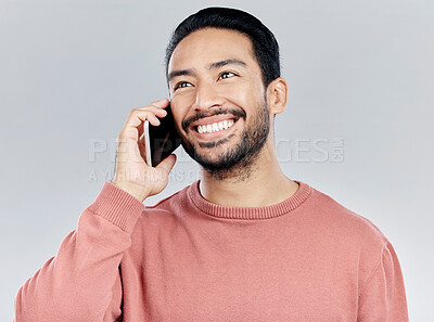 Buy stock photo Happy, young asian man and phone call in studio for communication, networking and white background. Student male model, smartphone and excited smile for chat, listening and talking with happiness