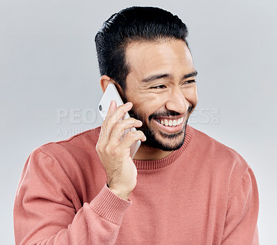 Buy stock photo Asian man, phone call and laughing for funny conversation, discussion or joke against a white studio background. Happy male laugh and talking on mobile smartphone for fun chat, communication or meme