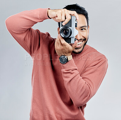 Buy stock photo Man with camera, photography in portrait with smile, taking picture with art and smile isolated on studio background. Photographer, happiness and creativity with vintage technology with creative male