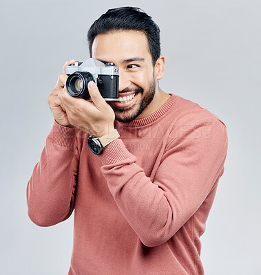 Buy stock photo Man with camera, photography and happy with smile, taking picture with art isolated on studio background. Photographer, happiness and creativity with vintage technology with creative male artist