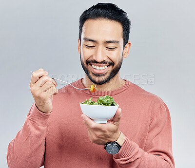Buy stock photo Man, salad food and eating healthy in studio for health or wellness motivation for vegetables. Asian male happy with vegetable for nutrition, diet and benefits to lose weight on a white background
