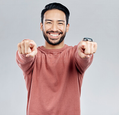 Buy stock photo Pointing, selection and smile with portrait of man in studio for thank you, motivation and amazing. Winner, confident and friendly with male on white background for yes, achievement and satisfaction