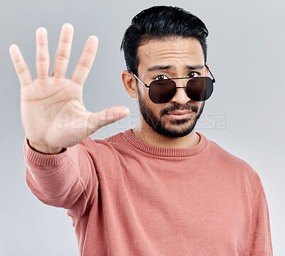 Buy stock photo Stop, portrait and a cool man with sunglasses isolated on a white background in a studio. No, rejection and an Asian guy  with a hand sign for warning, security and bouncer with decline on a backdrop